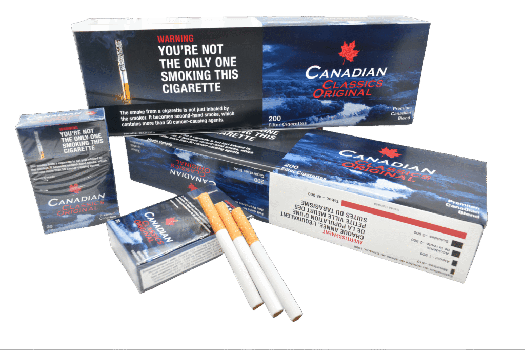 Canadian Classics Original cigarette packs and loose cigarettes with red maple leaf logo and premium blend text.