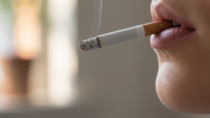 Person smoking cigarette properly with controlled puff technique demonstrating safe cigarette smoking methods for beginners guide.